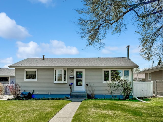 single story home with fence and a front yard