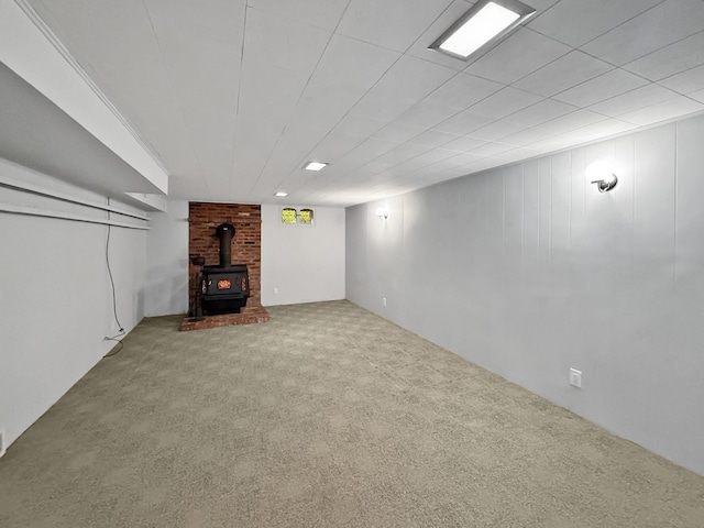 finished below grade area with carpet and a wood stove