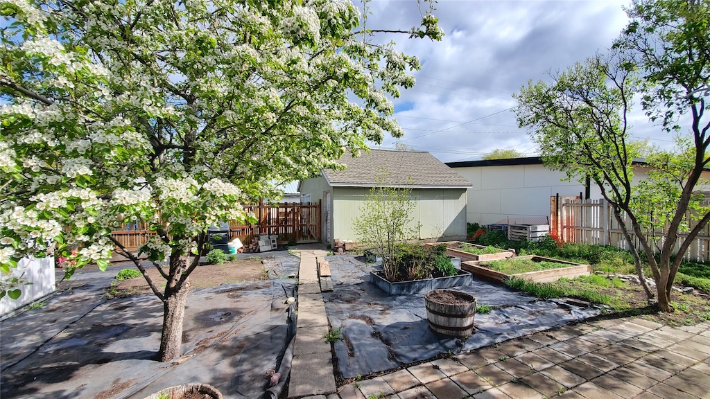 view of patio / terrace featuring a garden and fence