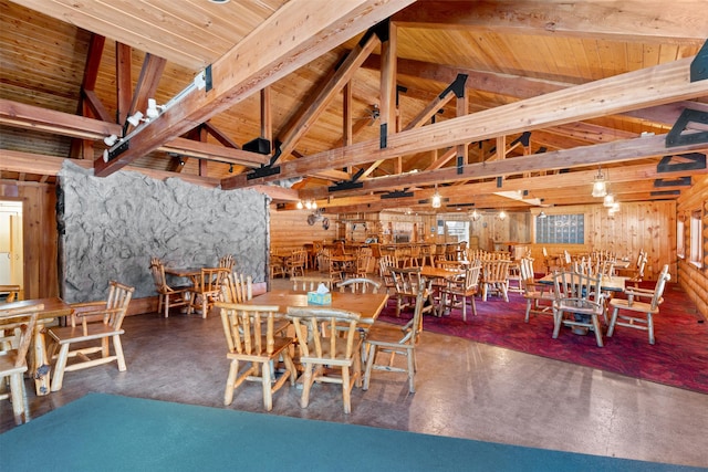 dining room featuring wooden ceiling, high vaulted ceiling, finished concrete flooring, and beam ceiling
