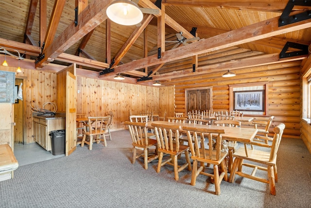 dining space featuring carpet, wood ceiling, and high vaulted ceiling