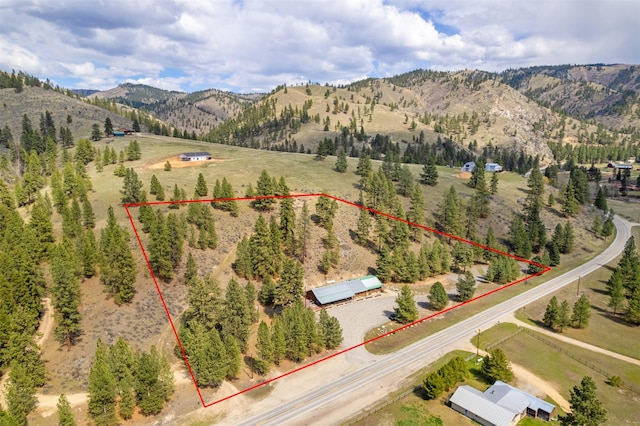 drone / aerial view featuring a mountain view and a rural view