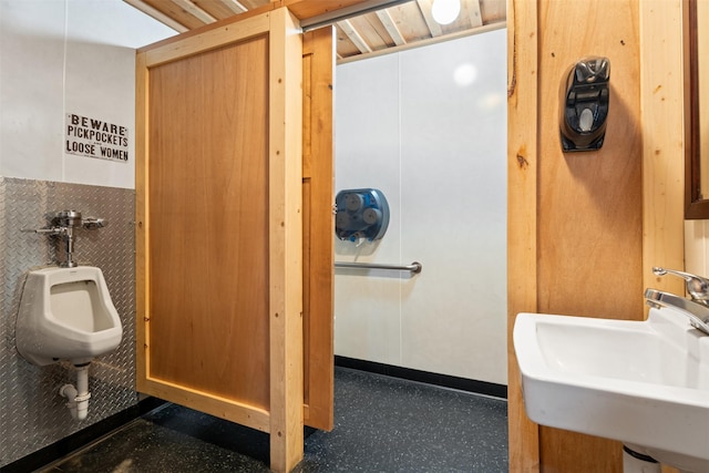 half bathroom featuring a sink
