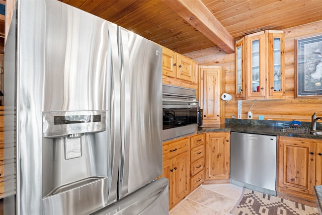 kitchen featuring a sink, stainless steel appliances, wooden ceiling, beamed ceiling, and glass insert cabinets