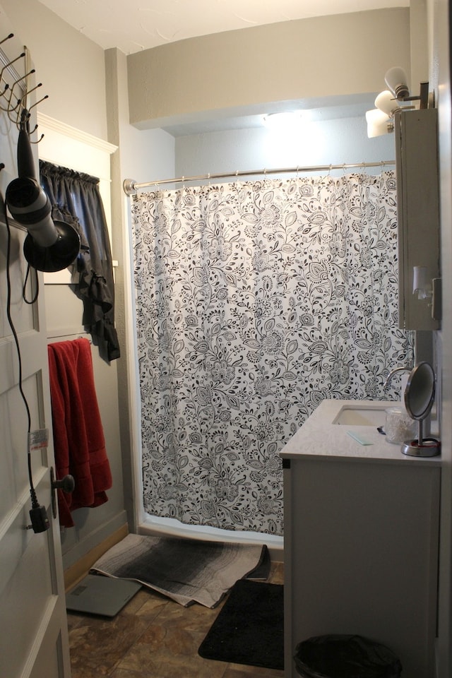 full bathroom featuring vanity and a shower with curtain