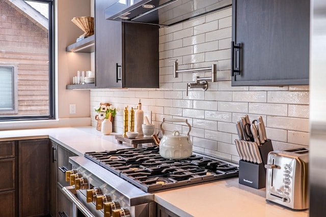 kitchen featuring decorative backsplash, double oven range, open shelves, dark brown cabinets, and light countertops