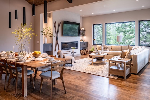 living area featuring recessed lighting, wood finished floors, and a wealth of natural light