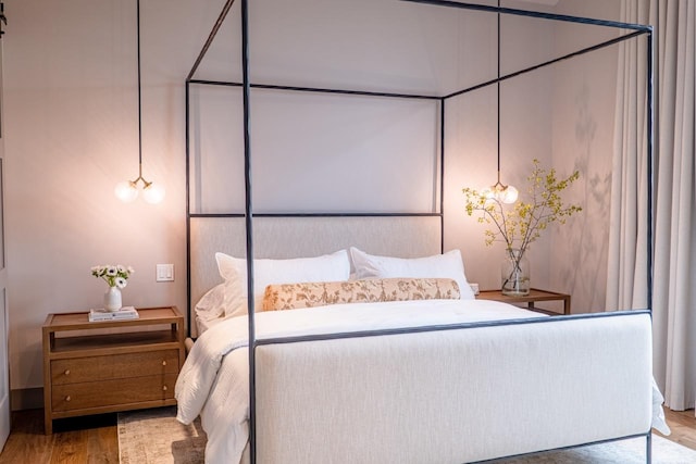 bedroom with wood finished floors