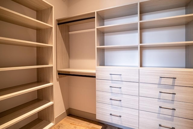 walk in closet featuring light wood-type flooring