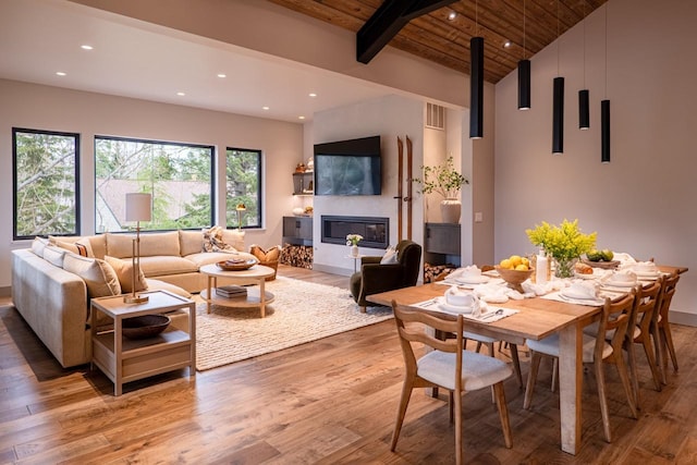 living area featuring recessed lighting, visible vents, wooden ceiling, and light wood-style floors