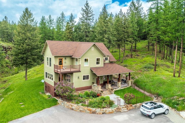 6710 Farm To Market Rd, Whitefish, MT 59937 - view of front facade featuring driveway, a porch, and a front yard