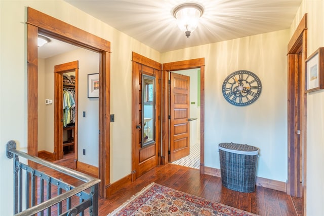 entrance foyer with baseboards and hardwood / wood-style floors