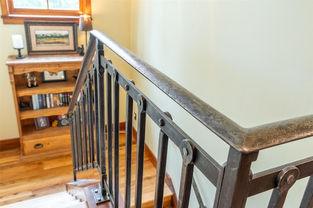 staircase featuring wood finished floors
