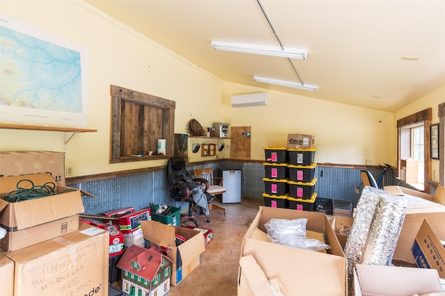 interior space with wainscoting and an AC wall unit