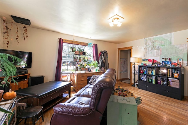 living area with hardwood / wood-style flooring
