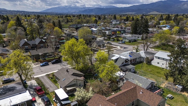 birds eye view of property featuring a mountain view and a residential view