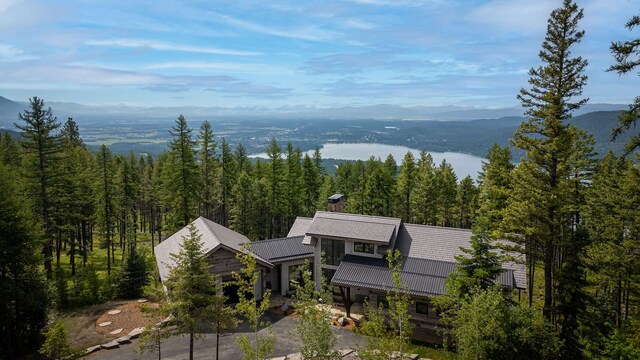 aerial view with a view of trees and a mountain view