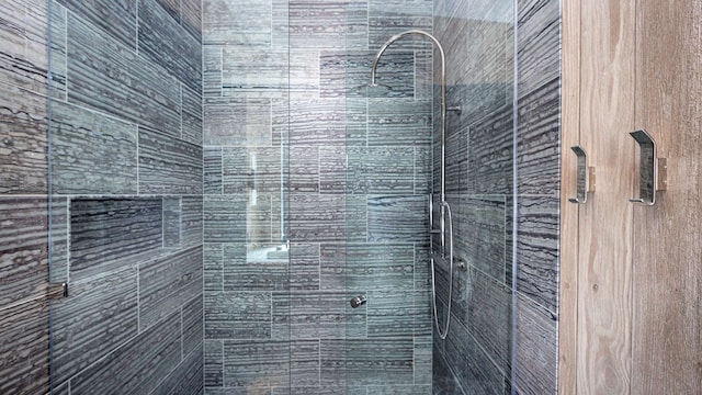 full bath featuring a shower stall