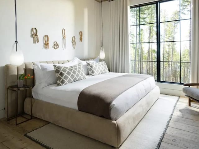 bedroom with hardwood / wood-style floors