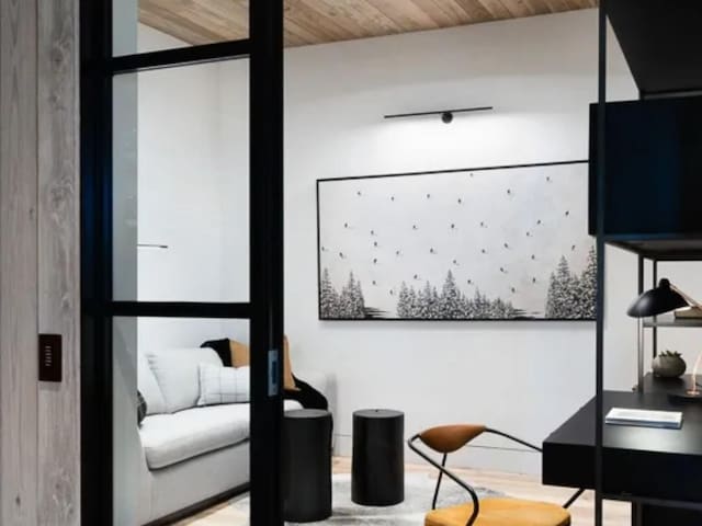 interior space with wood finished floors and wooden ceiling