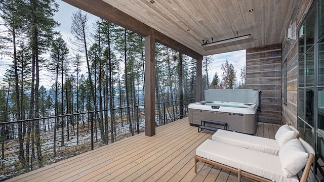 deck featuring a hot tub