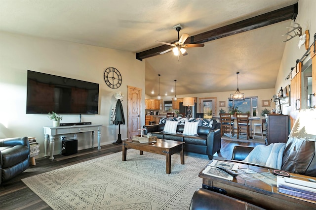 living room featuring ceiling fan, lofted ceiling with beams, a barn door, and wood finished floors