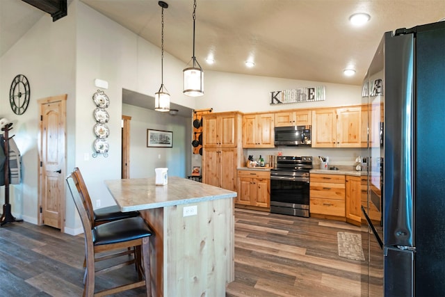 kitchen with light countertops, stainless steel appliances, dark wood-style flooring, and light brown cabinets