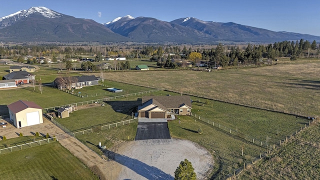 birds eye view of property with a mountain view and a rural view