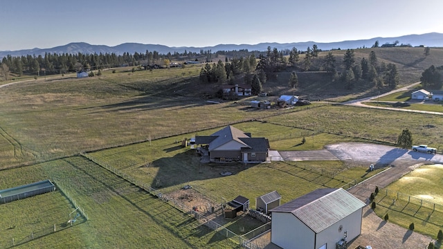 birds eye view of property featuring a mountain view and a rural view
