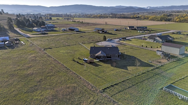 birds eye view of property featuring a mountain view and a rural view