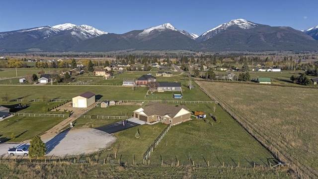 drone / aerial view with a mountain view and a rural view