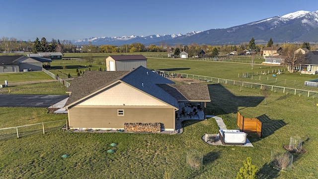 birds eye view of property with a mountain view