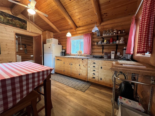 557 Crows Nest Main St, Haugan, MT 59842 - kitchen with white appliances, tile countertops, vaulted ceiling with beams, light wood-type flooring, and log walls