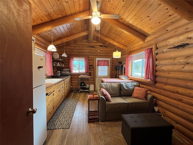 557 Crows Nest Main St, Haugan, MT 59842 - living room with rustic walls, lofted ceiling with beams, wooden ceiling, and hardwood / wood-style flooring