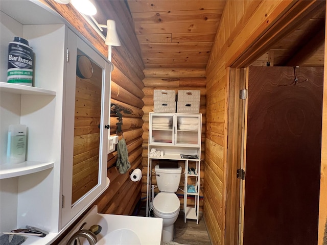 557 Crows Nest Main St, Haugan, MT 59842 - bathroom featuring rustic walls, wood finished floors, lofted ceiling, toilet, and wooden ceiling