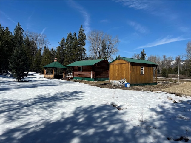 557 Crows Nest Main St, Haugan, MT 59842 - view of front of home with a storage unit, an outbuilding, and a gazebo