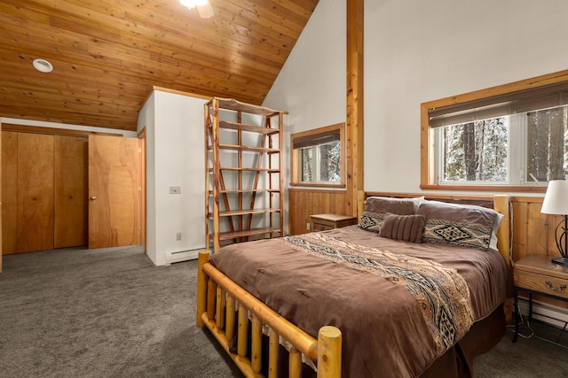 carpeted bedroom featuring baseboard heating, high vaulted ceiling, and wooden ceiling