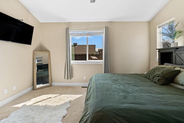carpeted bedroom with baseboards