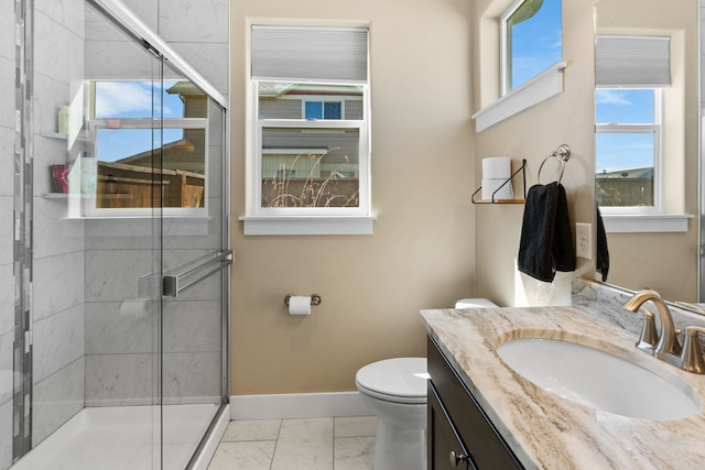 full bathroom featuring a shower stall, vanity, baseboards, toilet, and marble finish floor
