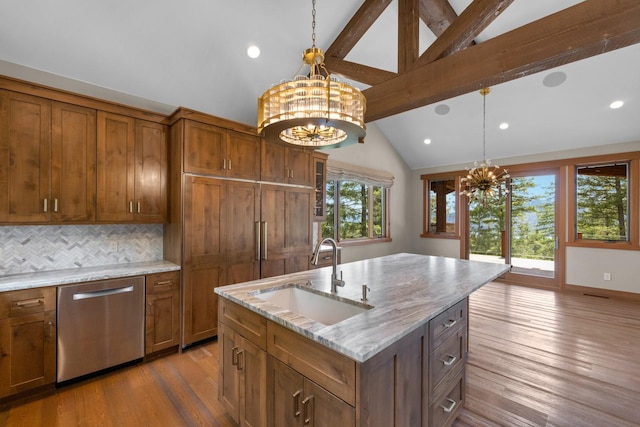 kitchen featuring brown cabinets, dark wood-style flooring, an inviting chandelier, a sink, and stainless steel dishwasher