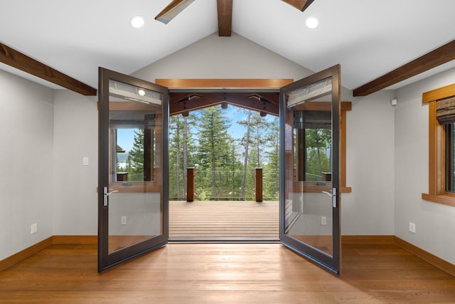 doorway featuring vaulted ceiling with beams, baseboards, recessed lighting, and wood finished floors