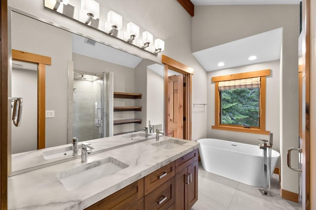full bathroom featuring a sink, a shower stall, and vaulted ceiling