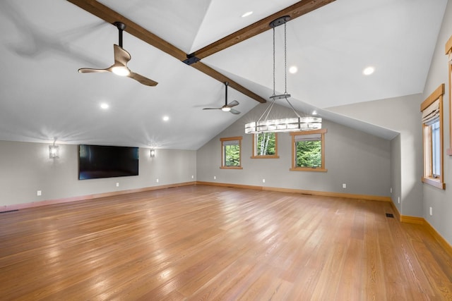 unfurnished living room with baseboards, vaulted ceiling with beams, a ceiling fan, and light wood-style flooring