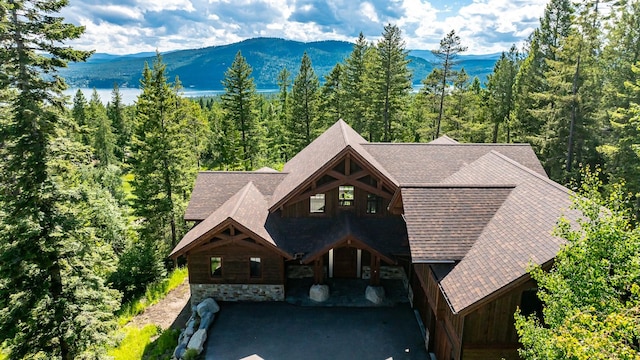 exterior space with a mountain view and a forest view