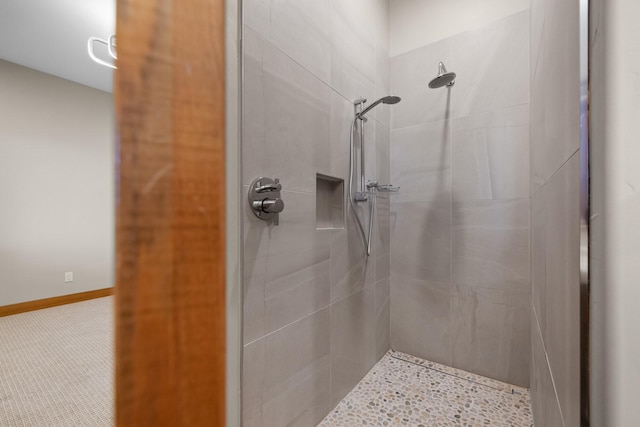 full bathroom featuring tiled shower