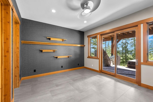 unfurnished room featuring baseboards, plenty of natural light, and recessed lighting