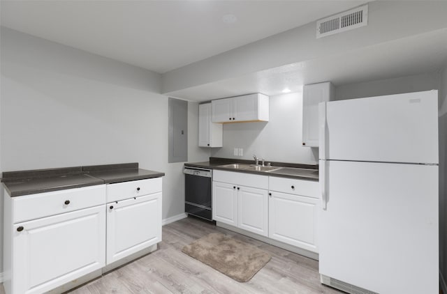 208 40th Ave NE, Great Falls, MT 59404 - kitchen featuring visible vents, dark countertops, a sink, freestanding refrigerator, and dishwashing machine