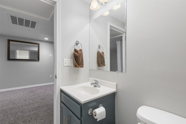 208 40th Ave NE, Great Falls, MT 59404 - bathroom featuring visible vents, baseboards, toilet, and vanity