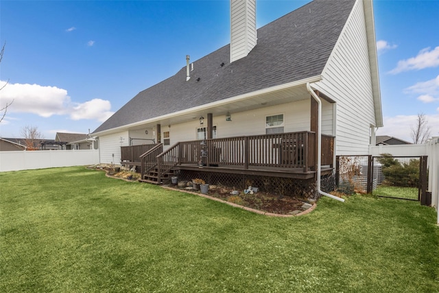 208 40th Ave NE, Great Falls, MT 59404 - rear view of house with a lawn, a shingled roof, a fenced backyard, and a chimney