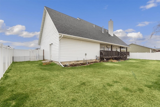 208 40th Ave NE, Great Falls, MT 59404 - back of house featuring a deck, a fenced backyard, a chimney, a shingled roof, and a yard